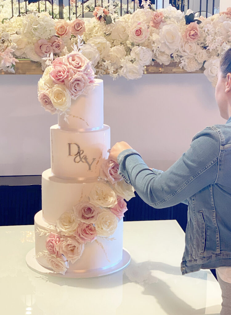 Wedding cake, with fresh flowers and gold leaf. fondant wedding cake. 