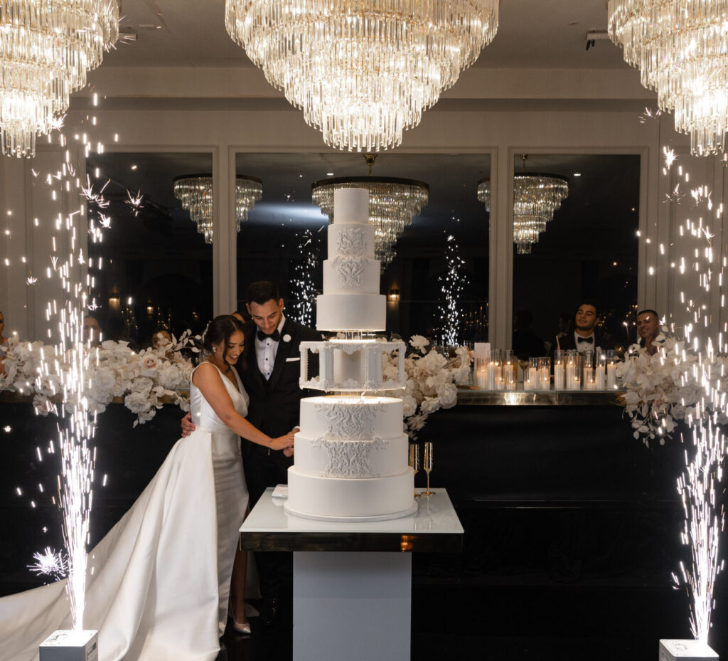 wedding cake cutting with fireworks 